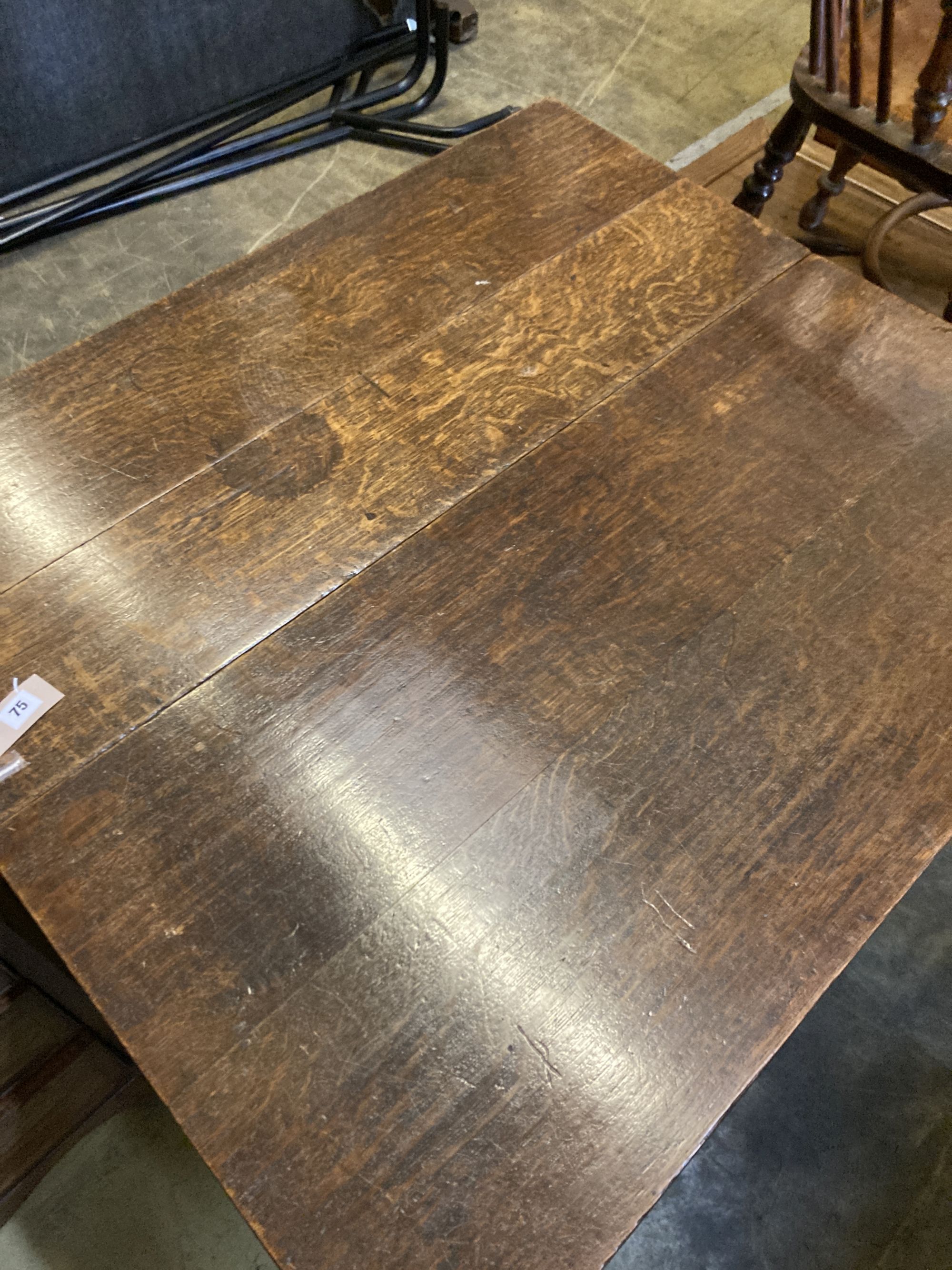 A George III oak pad foot drop leaf table, width106, length 143cm extended, height 72cm